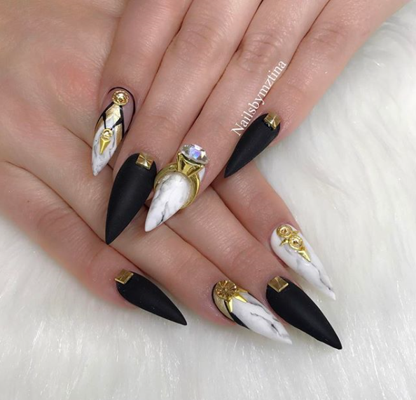 black and gold stiletto nails