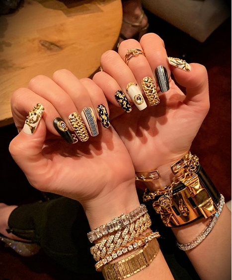 Piercings and Versace-Inspired nail art