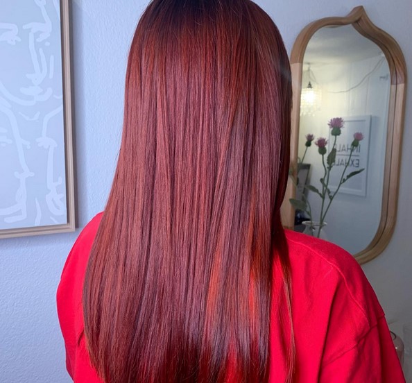 Long dark brown hair with pink highlights