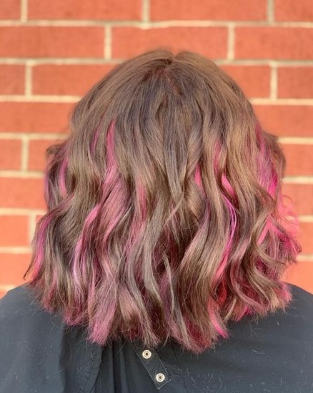 Short brown hair with pink highlight